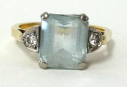 An 18ct aqua marine and diamond set ring