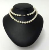 Mikimoto, a string of graduated pearls the clasp stamped 'M' in original case.