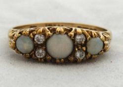 A 9ct opal and diamond dress ring.