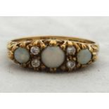 A 9ct opal and diamond dress ring.