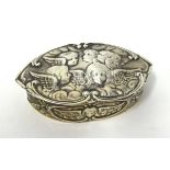 An Edwardian silver and gilt lined snuff box, Chester, with embossed cherub decoration.