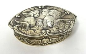 An Edwardian silver and gilt lined snuff box, Chester, with embossed cherub decoration.