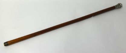 A Malacca walking cane with silver knop decorated with a Chinese design.