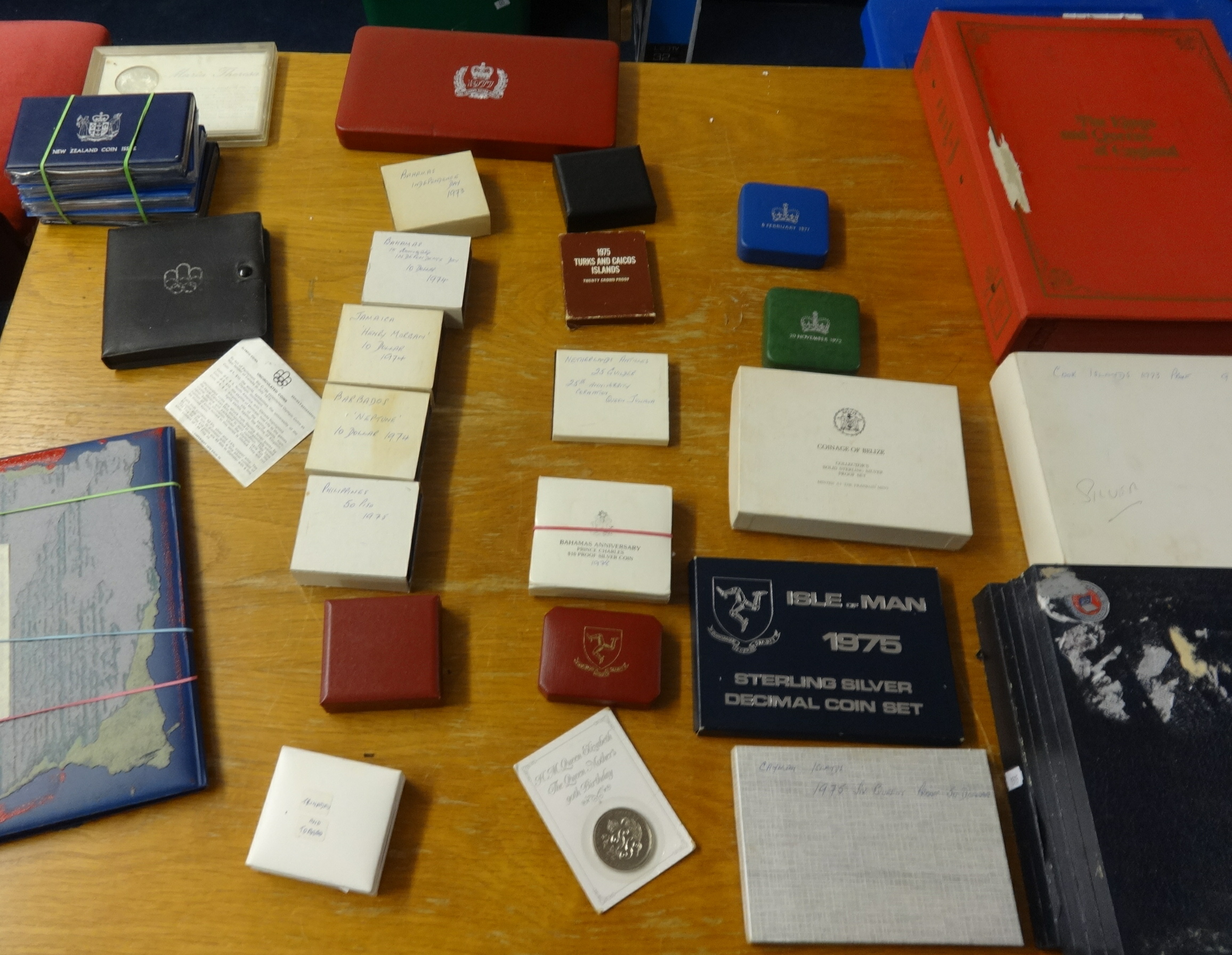 A large collection of silver commemorative coins, mainly boxed or in wallets, and also a quantity of