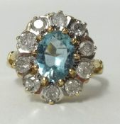 An aqua marine and diamond set ring in yellow gold, (approx 1.00 carat of diamonds), ring size Q.