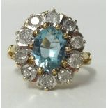 An aqua marine and diamond set ring in yellow gold, (approx 1.00 carat of diamonds), ring size Q.