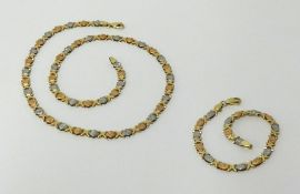 A 14k three coloured gold fancy link bracelet and similar necklace (18 inches long), approx 19.20