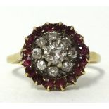 An antique diamond and ruby cluster ring set in yellow metal, (unhallmarked), diameter approx