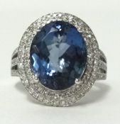 A 14k white gold tanzanite (approx 5.75 carats) and diamond (approx 1 carat total weight) set