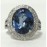 A 14k white gold tanzanite (approx 5.75 carats) and diamond (approx 1 carat total weight) set