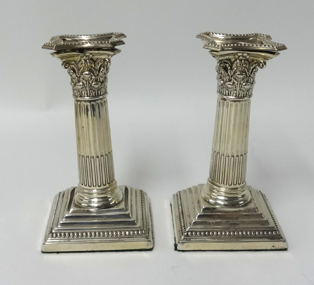 Pair of Victorian silver candlesticks, London 'EH', with original sconces of column design height