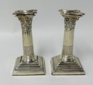 Pair of Victorian silver candlesticks, London 'EH', with original sconces of column design height