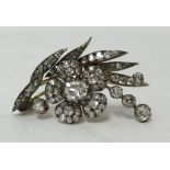 An impressive antique diamond brooch of spray flower form set with an arrangement of opal cut