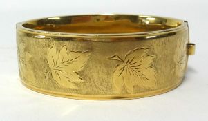 A 9ct gold wide bangle, stamped Patent 680368, approx 42gms.