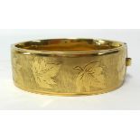 A 9ct gold wide bangle, stamped Patent 680368, approx 42gms.