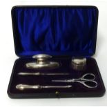 An Edwardian silver and other five piece nail buff set in fitted case.