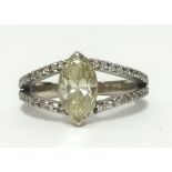 A fine 18ct diamond fancy yellow cluster ring, the centre marquis cut diamond approx 1.03cts,