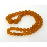 An amber style bead necklace, approx 68.30gms.