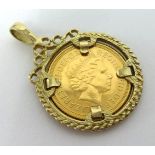 A QEII gold HALF sovereign, set in a 9ct pedant mount, 7.70gms total.