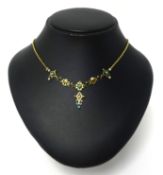 A vintage gold necklace set with turquoise and seed pearl.
