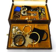A jewellery box with a quantity of various costume jewellery.