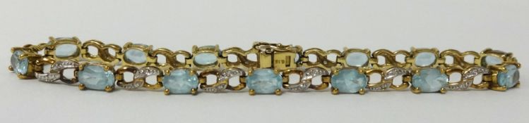 A 9ct gold topaz and diamond bracelet, approx 8.30gms