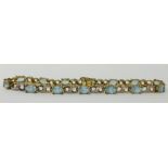 A 9ct gold topaz and diamond bracelet, approx 8.30gms