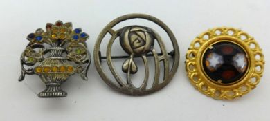 A modern Charles Rennie Mackintosh silver brooch, boxed together with a silver flower brooch and a