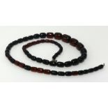 A red amber bead necklace, approx 97gms.