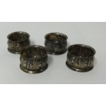 Set of four silver napkin rings with embossed design approx 50gms.
