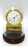 A 19th century English patinated brass and gilt metal Mantle clock, with replacement glass dome