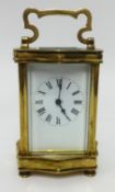 A French carriage clock with platform escapement, with travel case and key, height 16cm handle up.