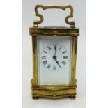 A French carriage clock with platform escapement, with travel case and key, height 16cm handle up.