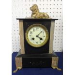 A Victorian slate/marble mantle clock, surmounted with a lion, height 34cm.