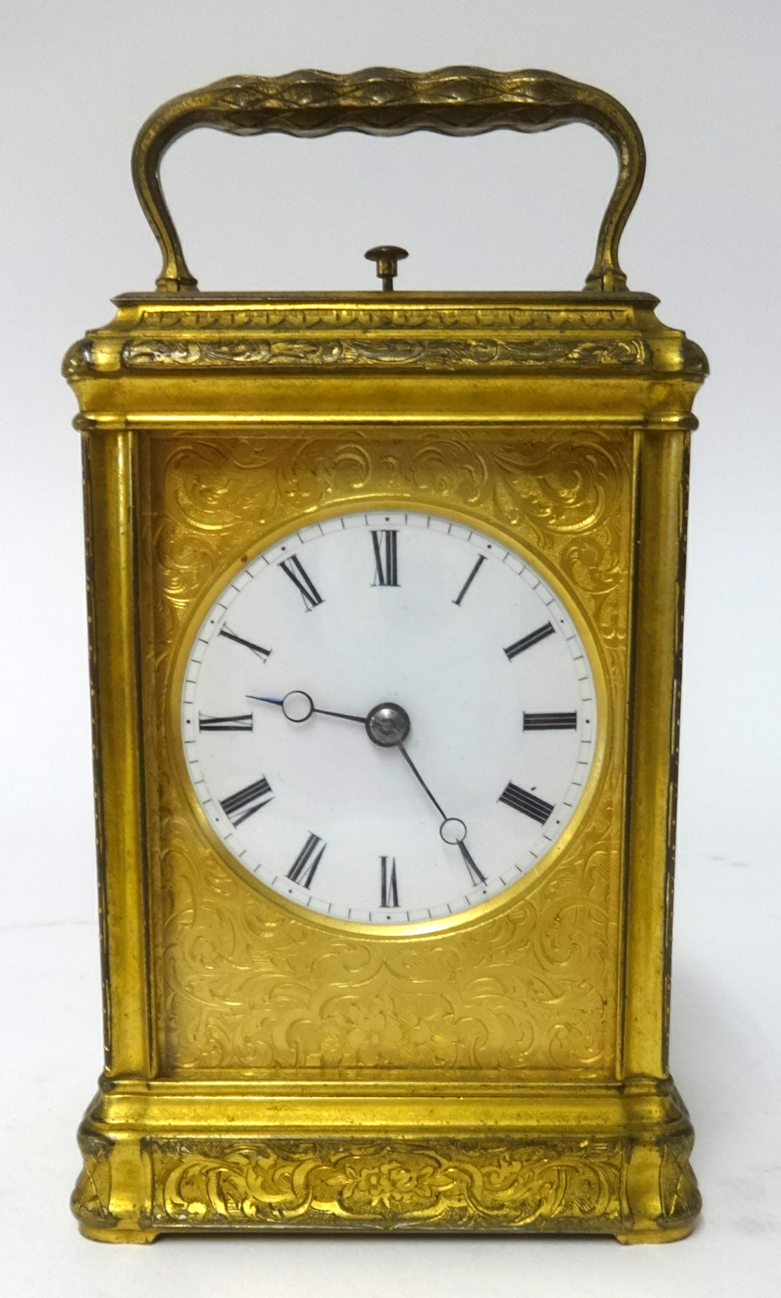 A 19th century gilt brass cased repeater carriage clock, key wind from back with platform