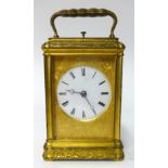 A 19th century gilt brass cased repeater carriage clock, key wind from back with platform