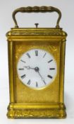 A 19th century gilt brass cased repeater carriage clock, key wind from back with platform