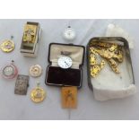 A quantity of pocket watch movements and assorted other items.