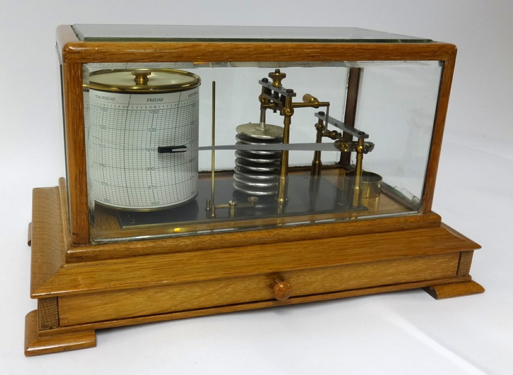 A light oak Barograph, stamped Callaghan & Co, 23a New Bond Street, London, beneath five panel