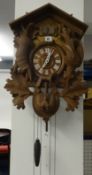 A reproduction ornate German cuckoo clock.