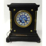 A Victorian wood cased mantle clock, with blue decorative dial, the 8 day French movement signed '