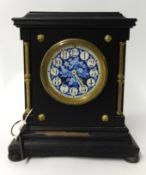 A Victorian wood cased mantle clock, with blue decorative dial, the 8 day French movement signed '