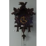 A German early 20th century dark oak cuckoo clock.