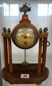 A Victorian portico style mantle clock with acorn finials, height 29cm.