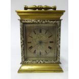 Small mantle clock with black roman dial with earlier movement housed into case, movement signed 'M.