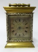 Small mantle clock with black roman dial with earlier movement housed into case, movement signed 'M.