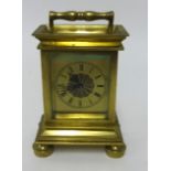 A brass cased clock set with a pocket watch verge movement, signed Williamson of Brighton No. 15116,
