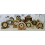 Collection of various small alabaster mantle clocks (11).