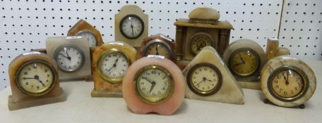 Collection of various small alabaster mantle clocks (11).