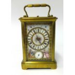 A 19th century French brass cased repeater and alarm carriage clock with porcelain dial and sides,